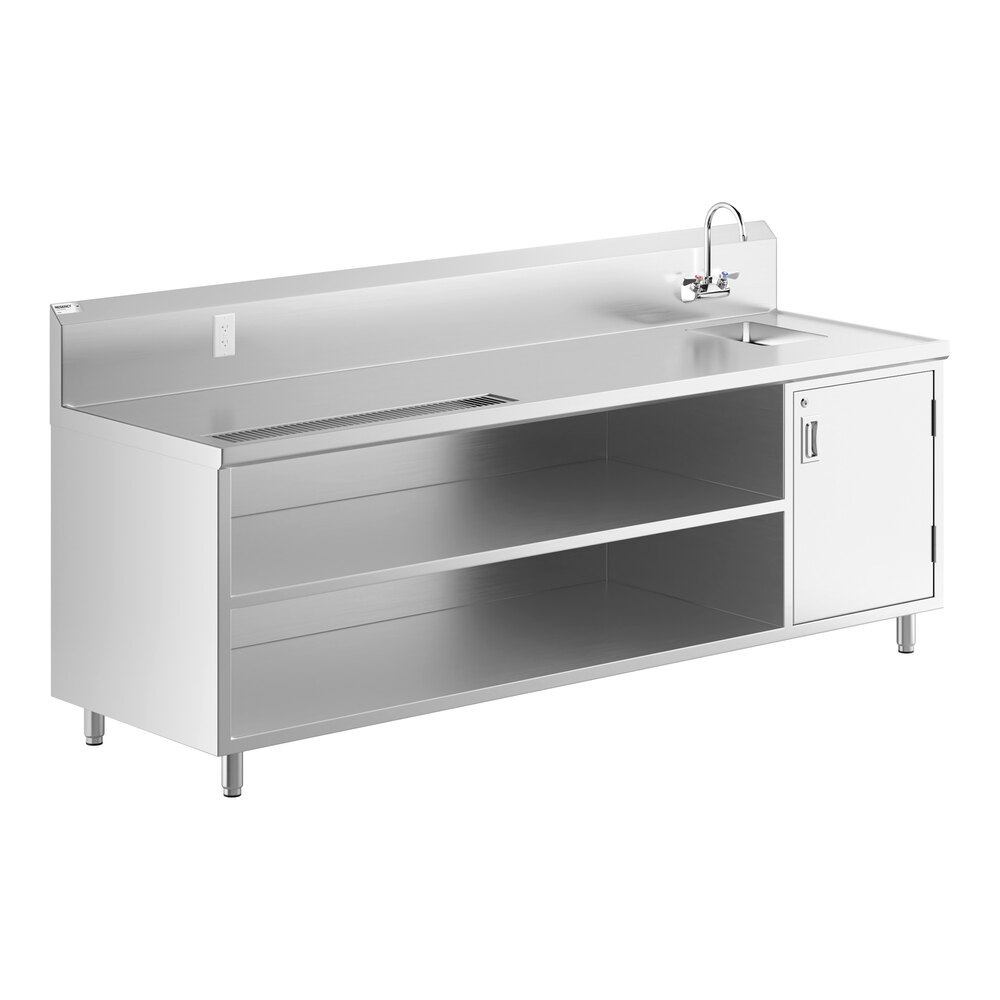 A stainless steel beverage table with a right-side sink, gooseneck faucet, open shelving, and a cabinet on the right.