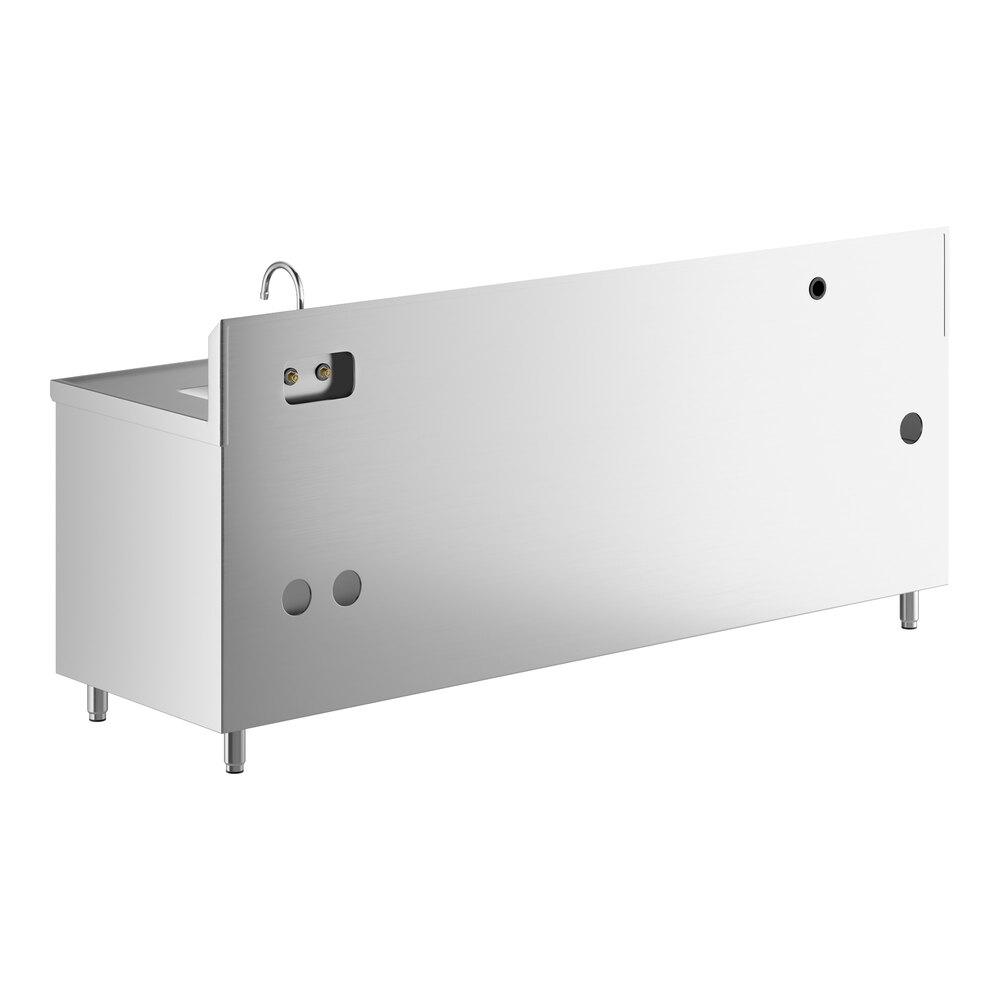 A large stainless steel table with a right-side sink, a gooseneck faucet, and multiple cutouts on the front panel, supported by four legs.