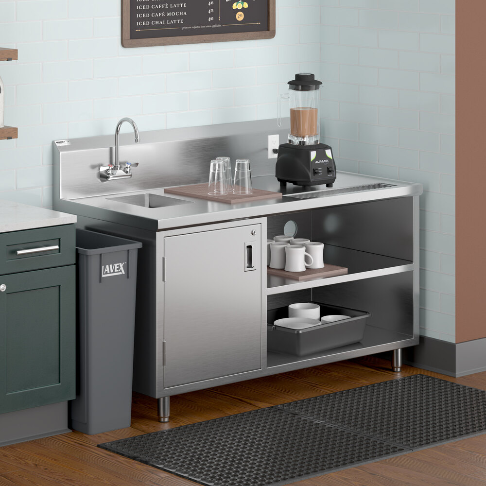 A stainless steel beverage table with a left-side sink, gooseneck faucet, open shelves, and a blender on the countertop.