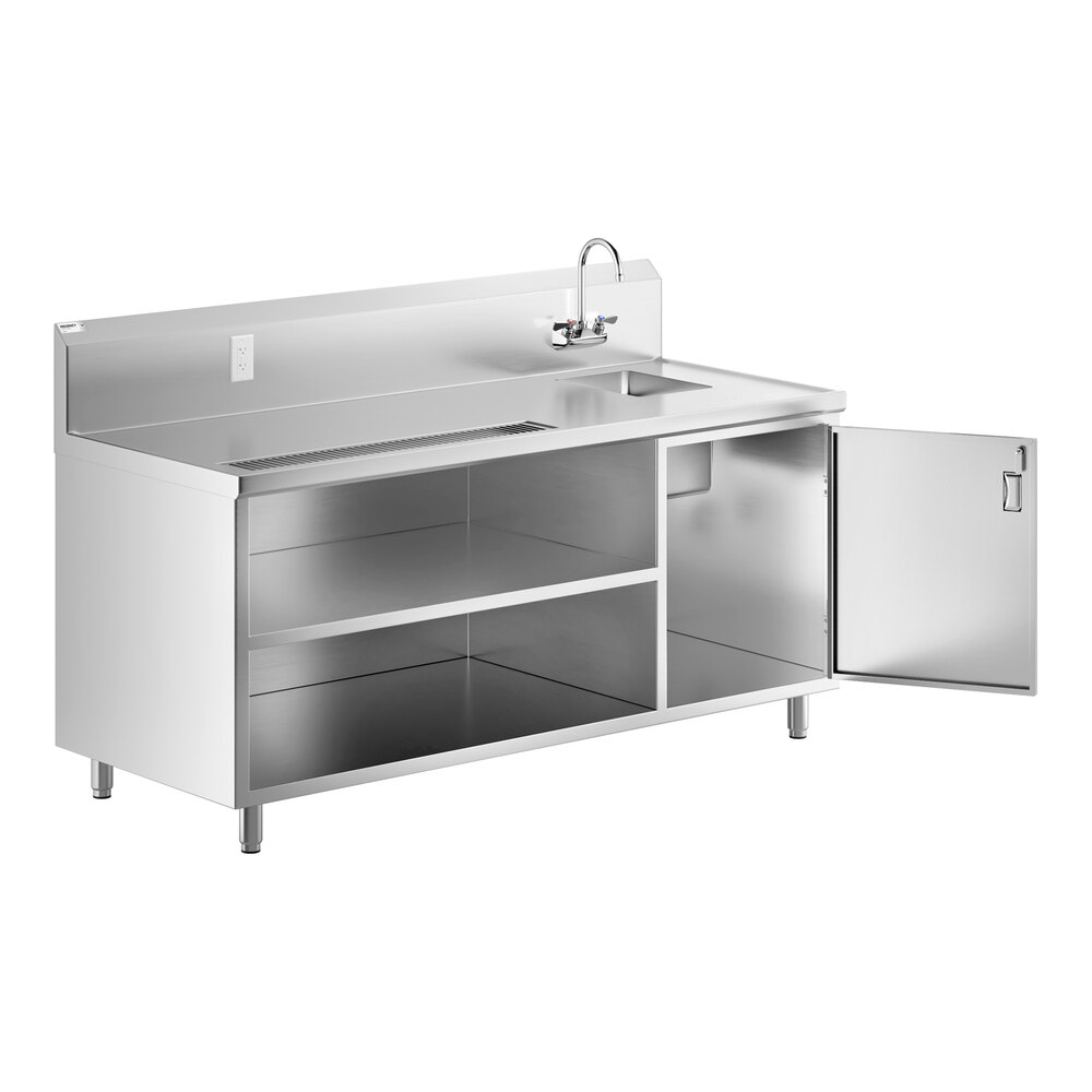A stainless steel beverage table with a right-side sink, gooseneck faucet, open shelving, and one cabinet door open.