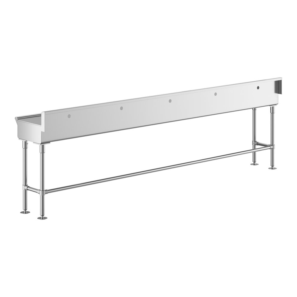 A long, rectangular stainless steel sink with five faucet holes, supported by metal legs and crossbars.