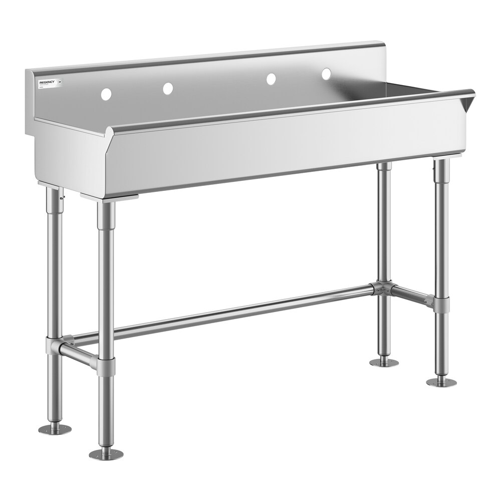A stainless steel commercial hand sink with four legs, a high backsplash, and three faucet holes.