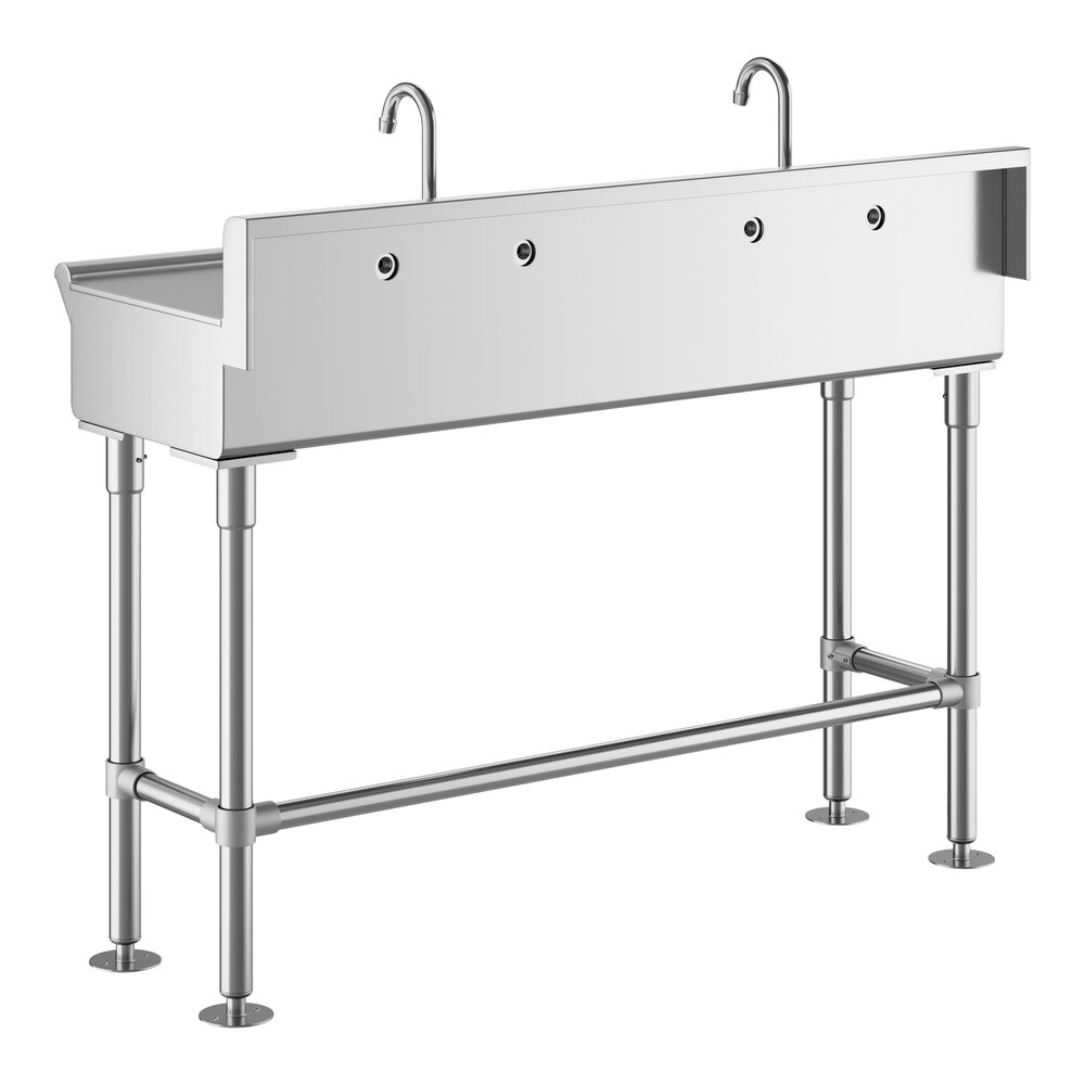 A stainless steel hand sink with two gooseneck faucets and four sturdy legs.