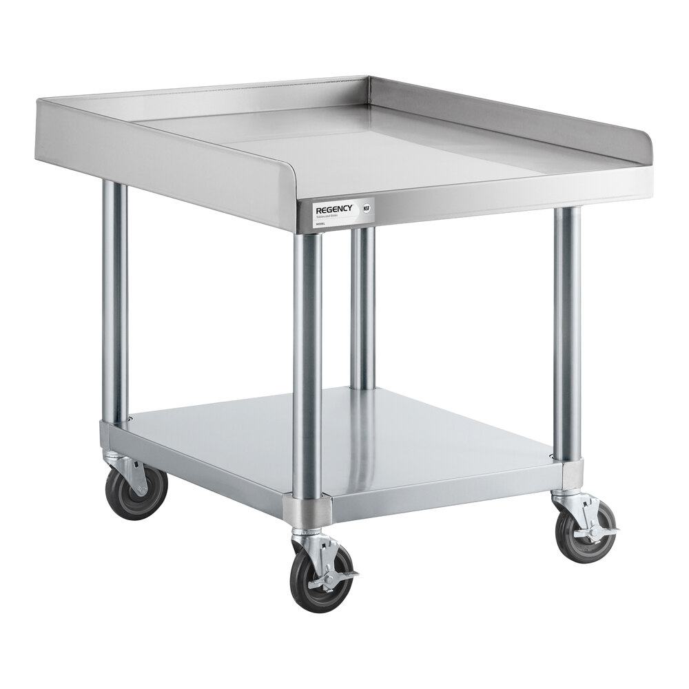 A stainless steel equipment stand with a raised edge, lower shelf, and four caster wheels.