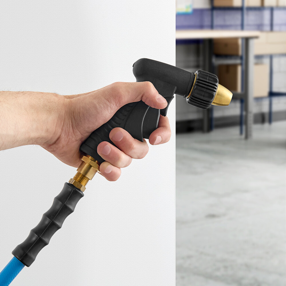 A hand holding a hose with a Regency double trigger spray nozzle.