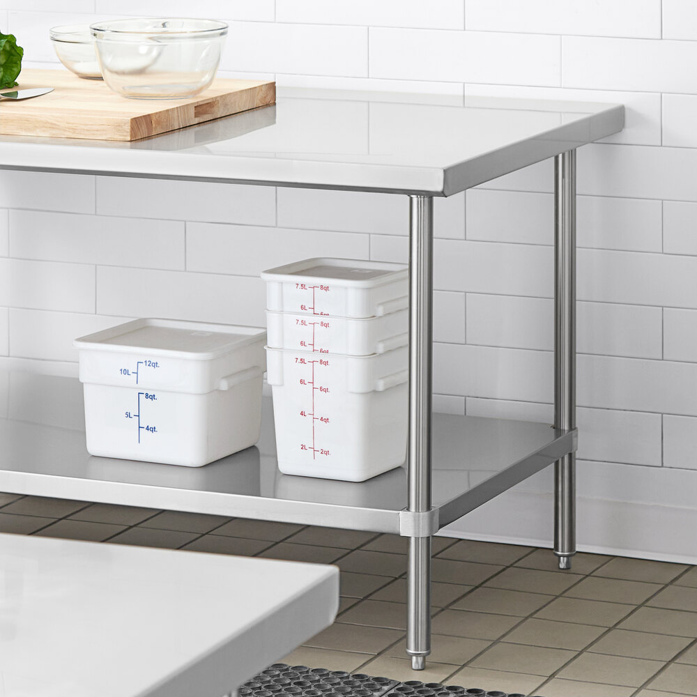 An adjustable stainless steel undershelf designed for 30 x 60 inch work tables, shown installed beneath a work table and holding food storage containers.