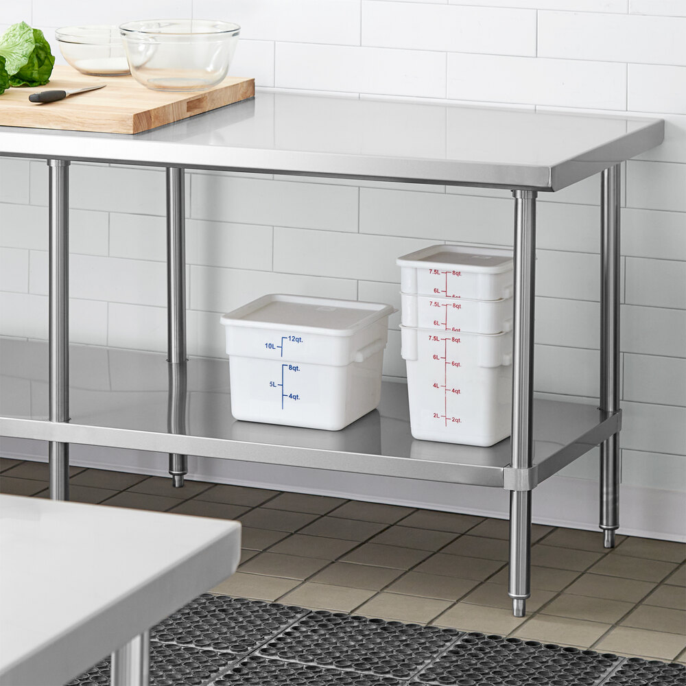 An adjustable stainless steel undershelf designed for 30-inch by 84-inch work tables, shown installed beneath a work surface in a commercial kitchen setting.