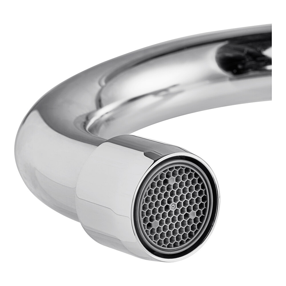 A close-up of a chrome wall-mount hands-free faucet spout with an aerator.