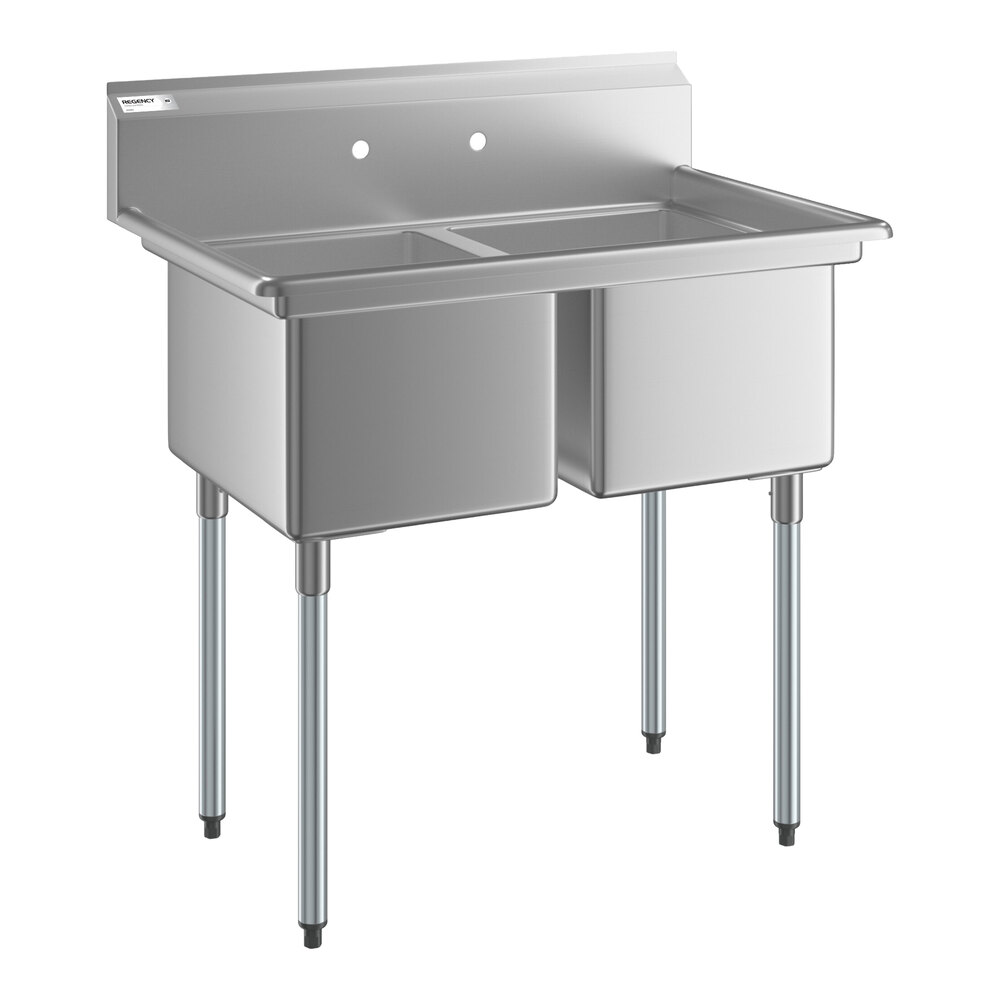 A stainless steel two-compartment sink with four metal legs and a backsplash, designed for commercial use.