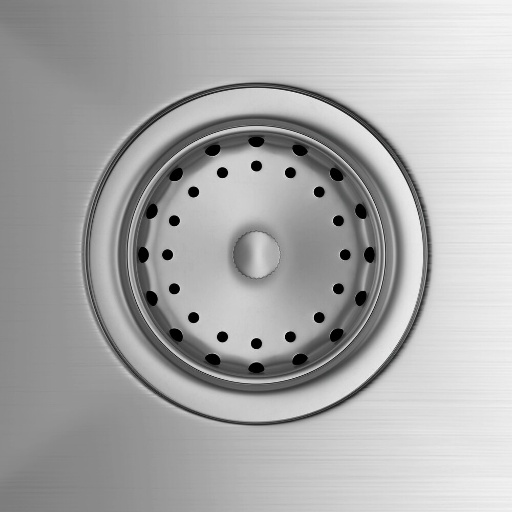 A stainless steel commercial sink drain with a perforated strainer basket.