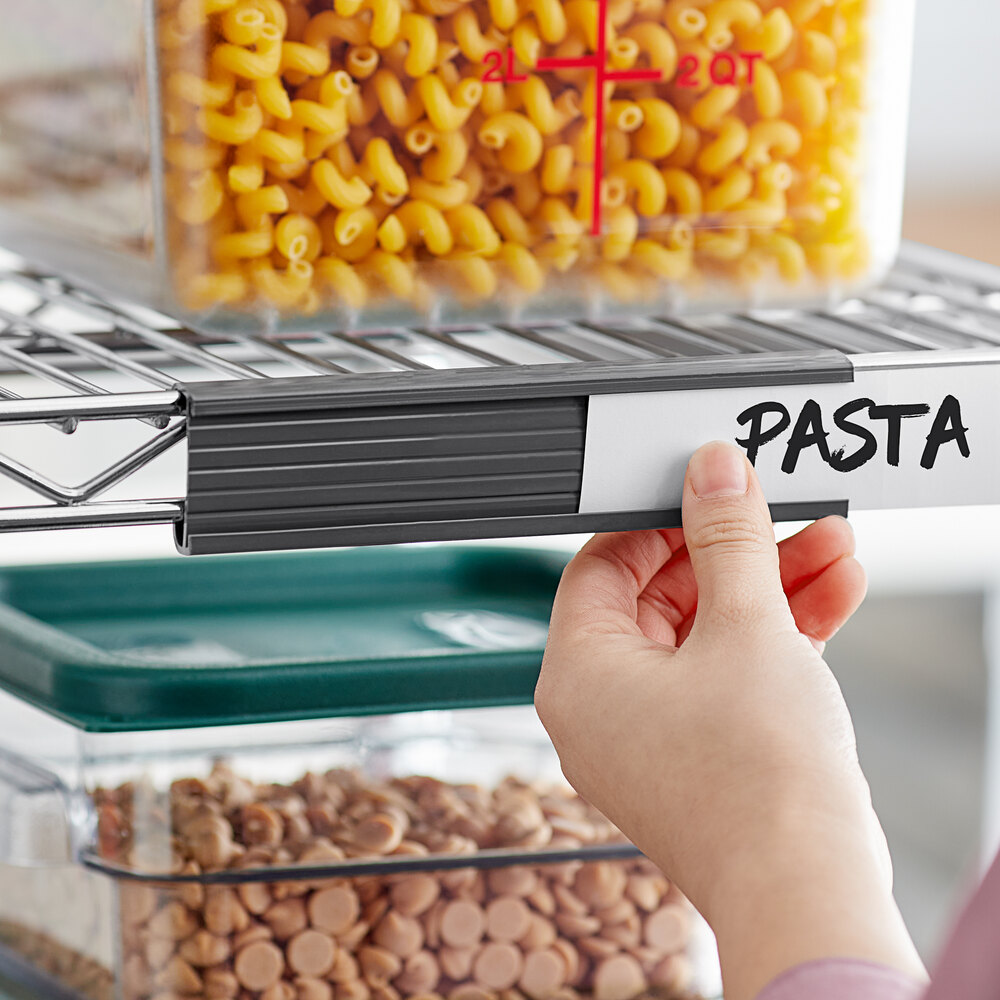 A gray label holder for wire shelving being used to organize pantry items.