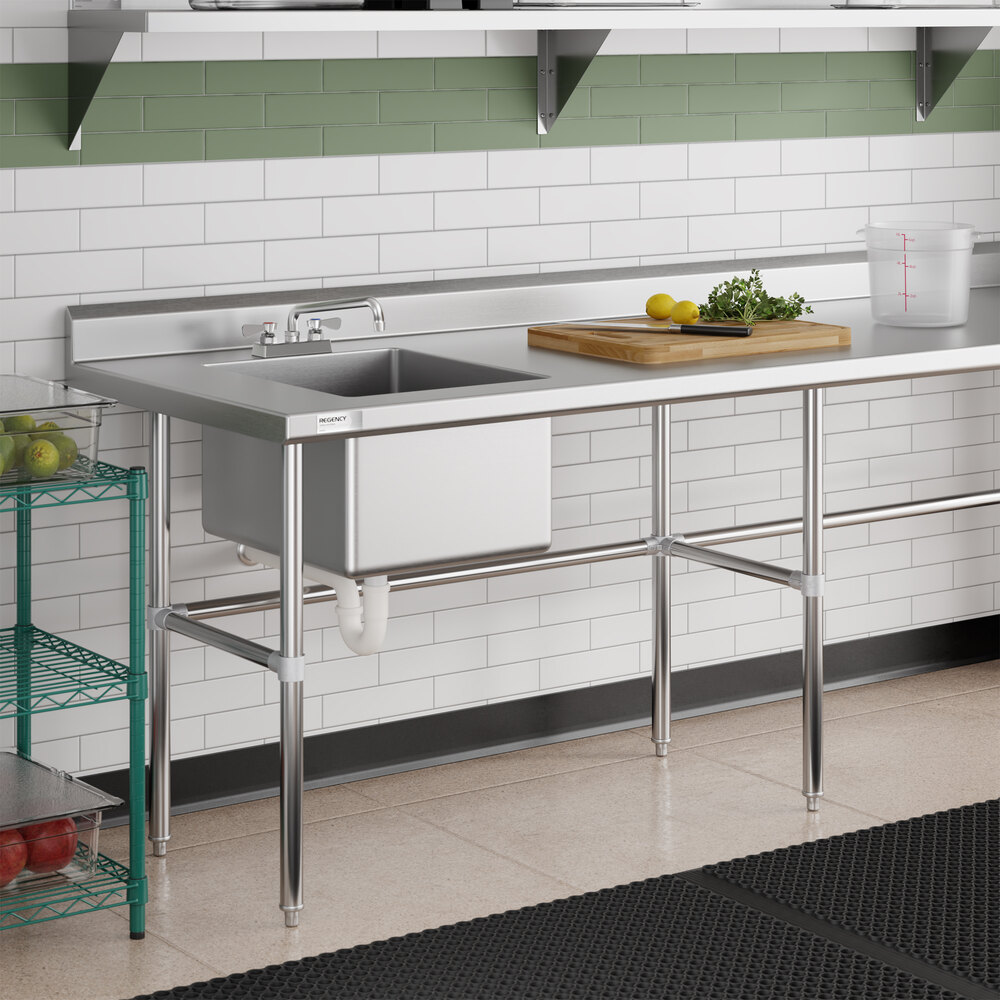 A stainless steel work table with a left-side sink and cross bracing, designed for commercial kitchen use.