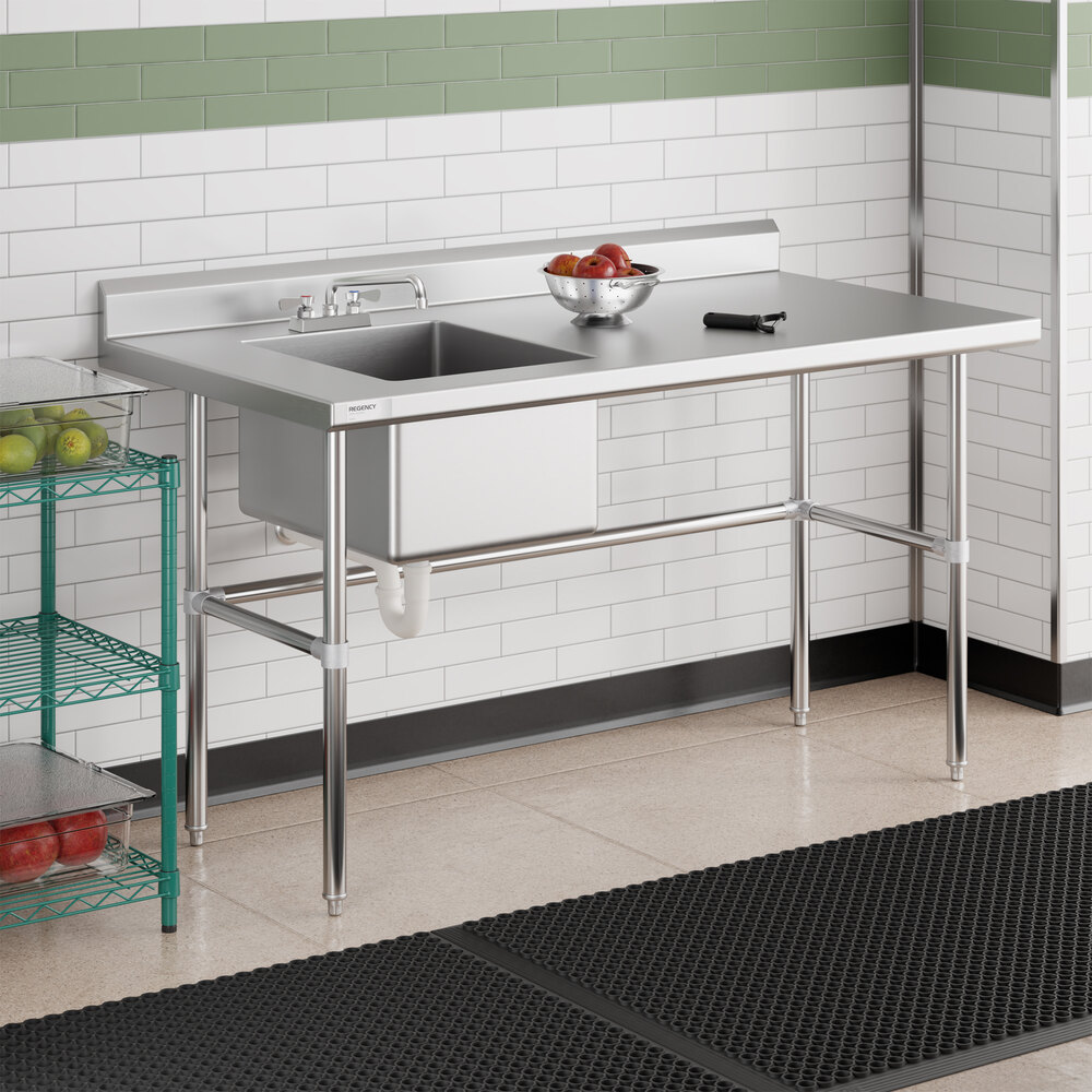 A stainless steel work table with a left-side sink, cross bracing, and a backsplash, designed for commercial kitchen use.