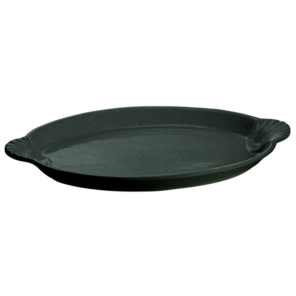 A black oval cast aluminum platter with green speckles and a handle.