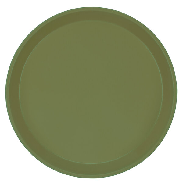 A close-up of a green Cambro round tray.