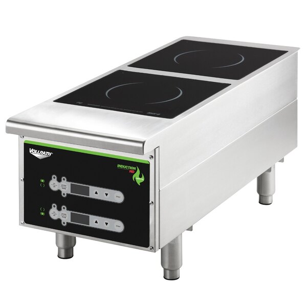 A Vollrath stainless steel double countertop induction hot plate with digital controls.