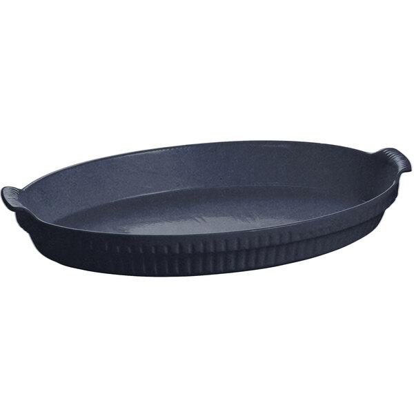 A black oval Tablecraft shallow casserole dish with a handle.