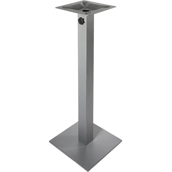 A silver metal square table base with a black circle in the center.