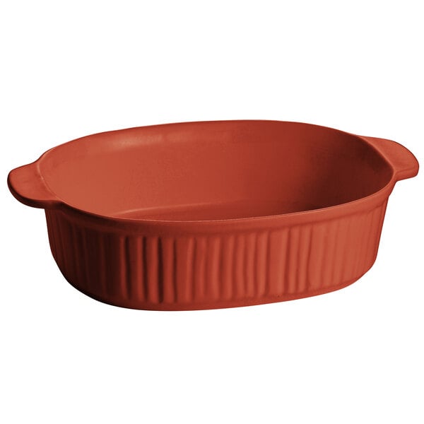 A red oval Tablecraft casserole dish with ridges and a handle.