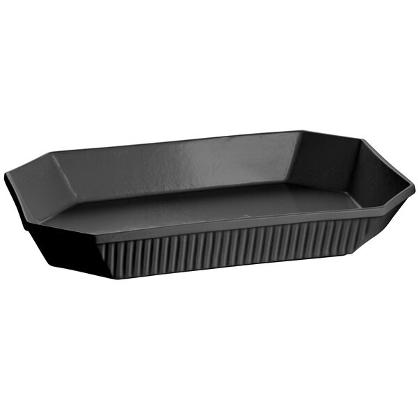 A black octagon casserole dish with a handle.