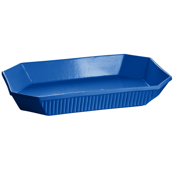 A cobalt blue Tablecraft octagon casserole dish with a curved edge and a handle.