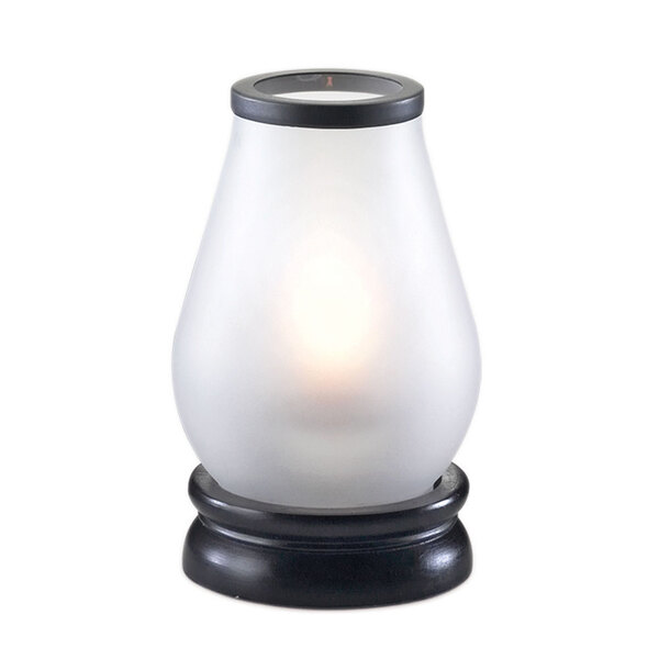 A white candle holder with a black wooden base.