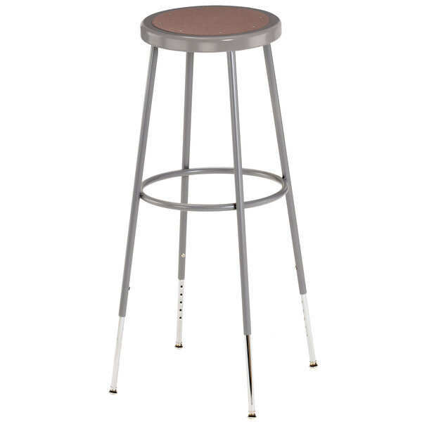 A National Public Seating lab stool with a brown seat and gray legs.