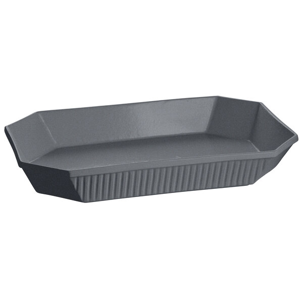 A grey cast aluminum octagon casserole dish with a handle.