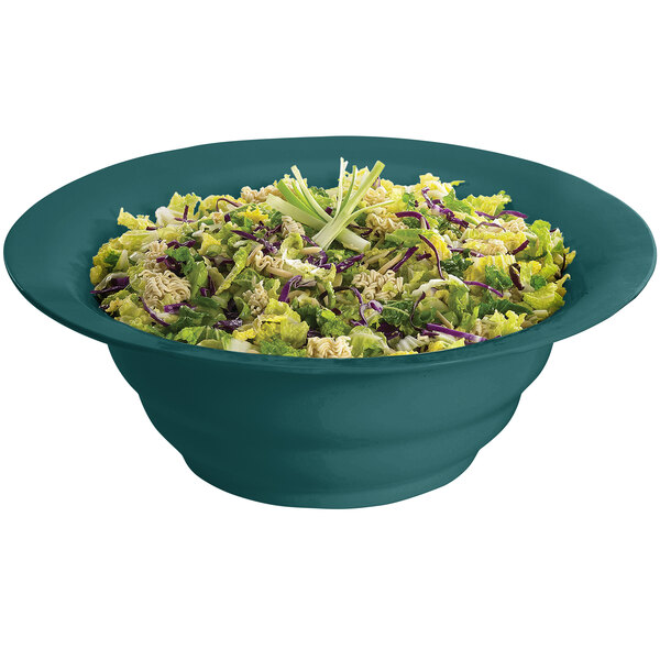 A Tablecraft hunter green cast aluminum salad bowl filled with salad on a white background.