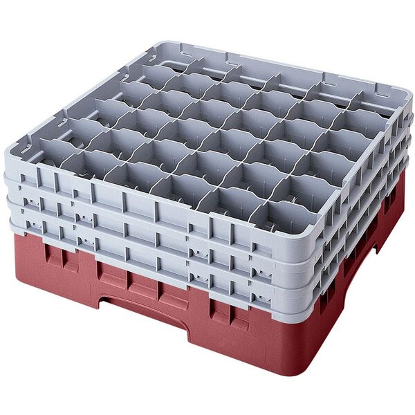 A red and gray plastic Cambro glass rack with 36 compartments.