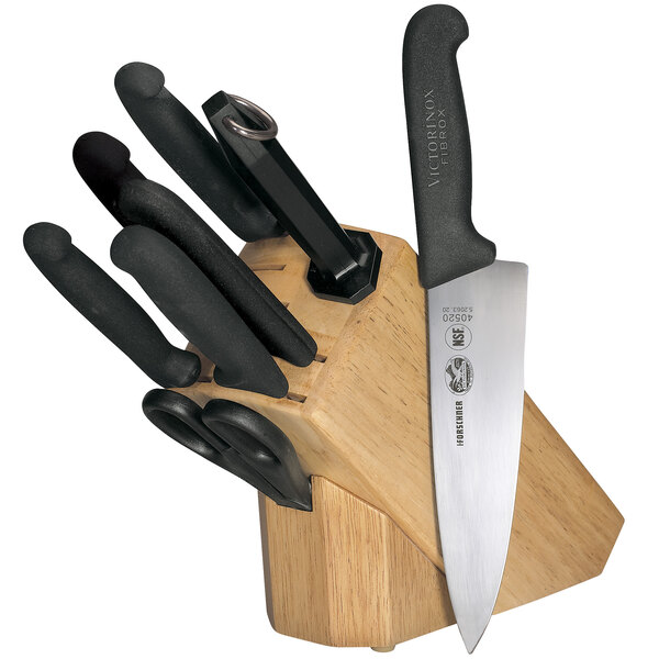 A Victorinox knife set in a wooden block.