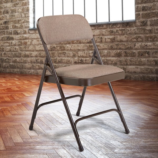 A National Public Seating brown metal folding chair with brown fabric padding.