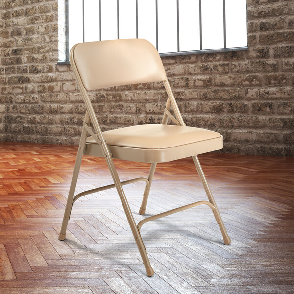 National Public Seating 1201 Beige Metal Folding Chair with 1 1/4" French Beige Vinyl Padded Seat