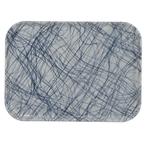 A white rectangular tray with blue swirl lines.