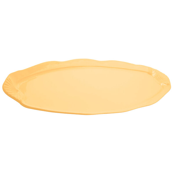 A yellow Bon Chef cast aluminum shell and fish platter with a textured finish on a white background.