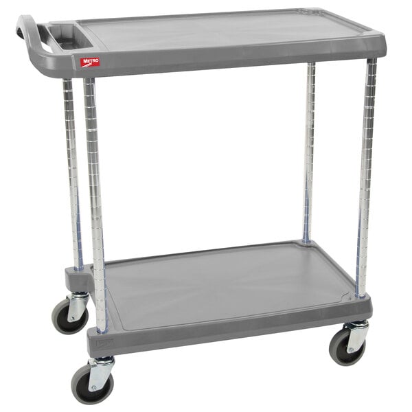 A gray Metro utility cart with two shelves and chrome legs.