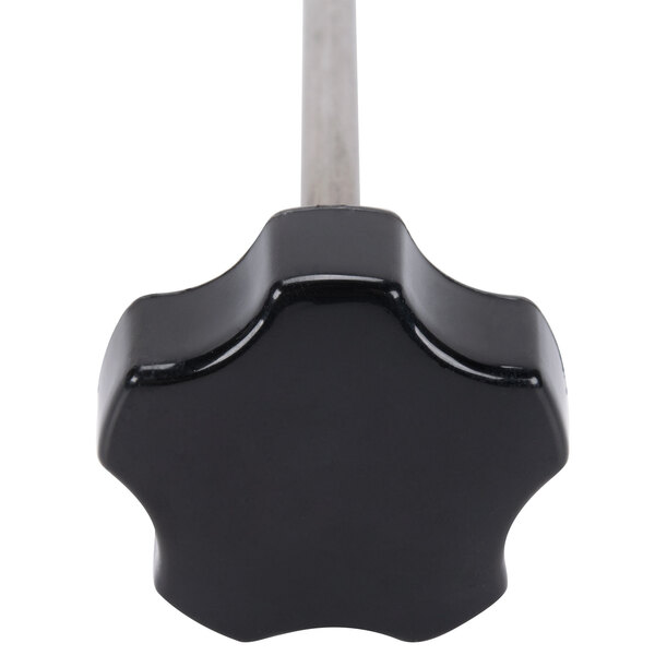 A black knob with a silver star-shaped screw.