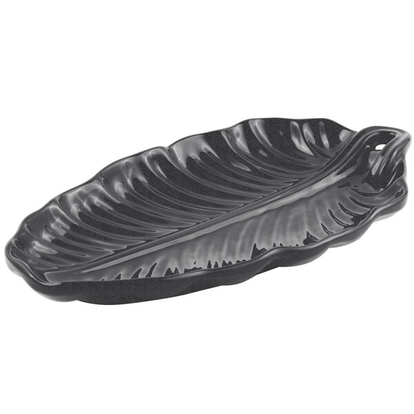 A black Bon Chef leaf platter with a sandstone finish and speckles on it.