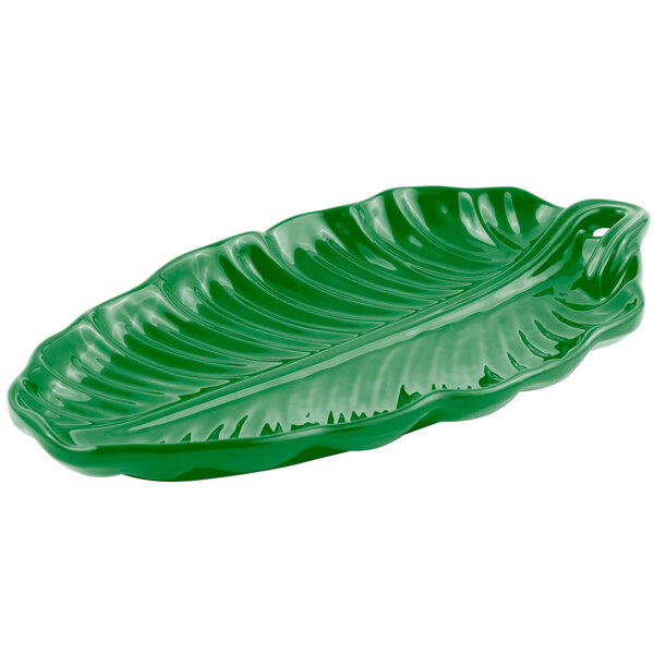 A green leaf-shaped Bon Chef cast aluminum platter with a handle.