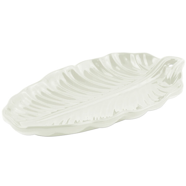 An ivory cast aluminum platter with a leaf pattern.