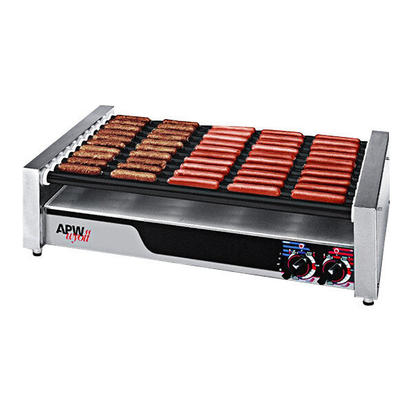 An APW Wyott hot dog roller grill with hot dogs cooking.