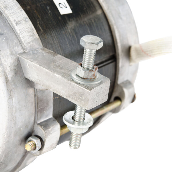 A close-up of a metal Avantco replacement motor with a white cord.