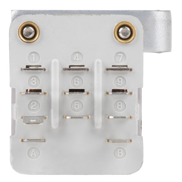 A white rectangular object with metal screws and rivets.