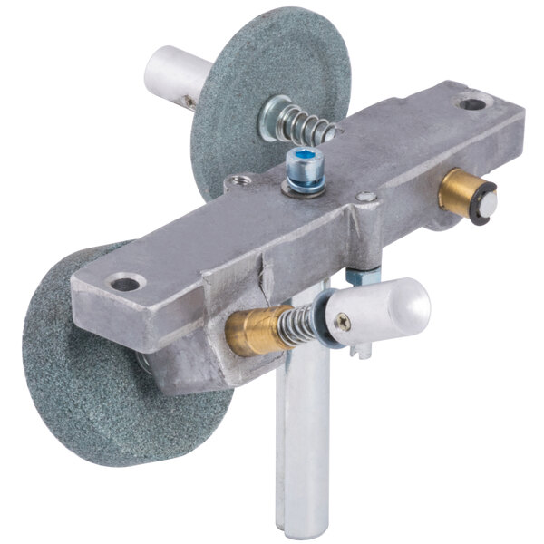 A metal Avantco sharpener assembly with a round object.