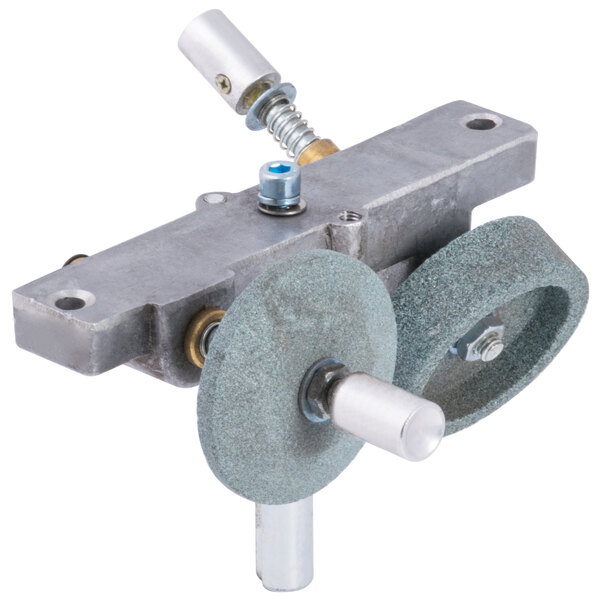 A close-up of the Avantco SL312 sharpener assembly with a metal grinding wheel and screws.