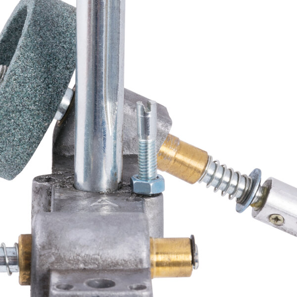 A metal Avantco sharpener assembly with a screw and a wheel.