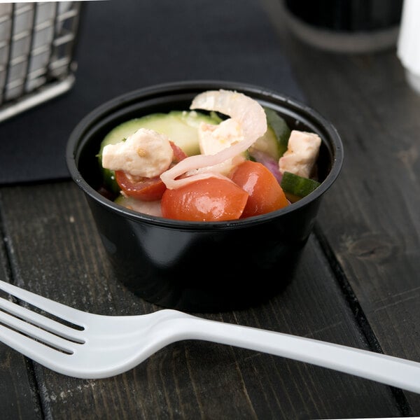 A white plastic spoon on a table.