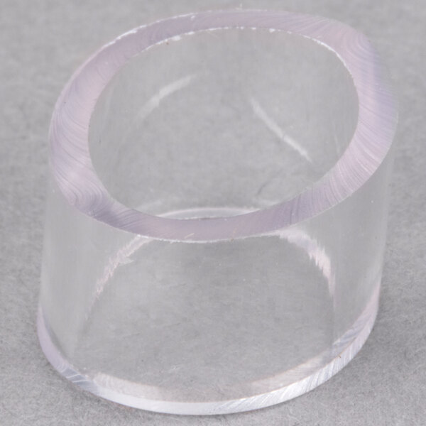 A clear plastic circular bumper with a hole in the middle.