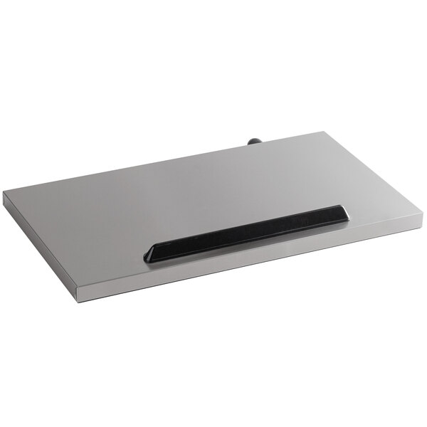 A rectangular silver lid with a black handle.