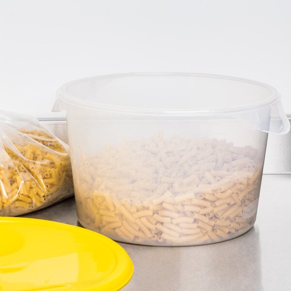 A translucent plastic container with pasta in it.